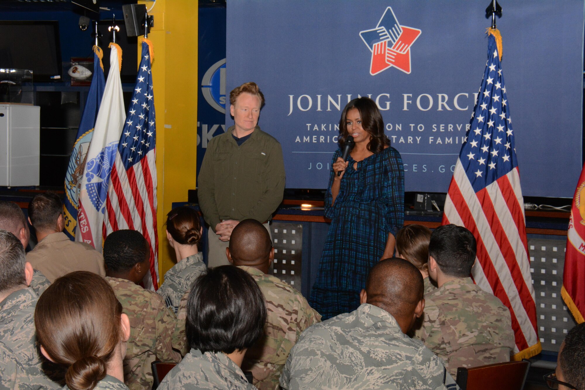 The first lady of the United States, Michelle Obama, greets service members at Al Udeid Air Base, Qatar, with late show host and comedian Conan O’Brien, during a base visit Nov. 3. Obama said she’s proud of and incredibly grateful for the hard work America’s military men and women do. “You’re the ones doing the tough work, without complaint and you’re representing our nation. I‘ve always been in awe of our military service members, our veterans and their families. Thank you, we love you,” she said. (U.S. Air Force photo by Tech. Sgt. James Hodgman)