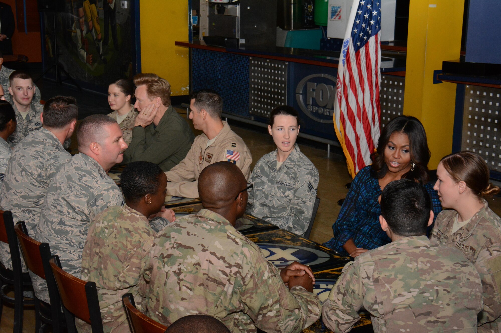 The first lady of the United States, Michelle Obama and late show host and comedian Conan O’Brien, meet with service members inside the Fox Skybox at Al Udeid Air Base, Qatar Nov. 3. Obama and O’Brien said they’re both very proud of the hard work America’s military men and women do. (U.S. Air Force photo by Tech. Sgt. James Hodgman) 