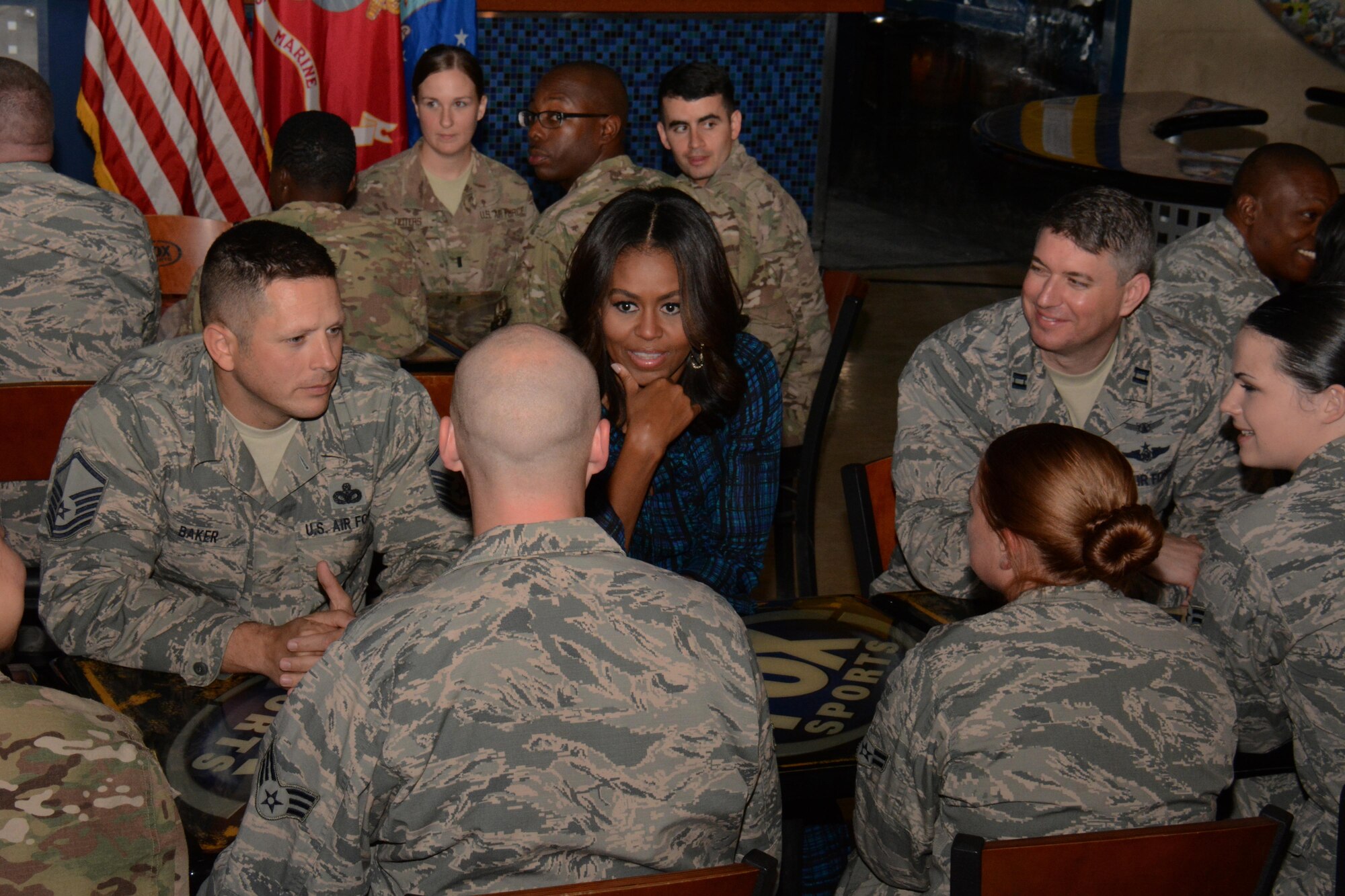 The first lady of the United States, Michelle Obama meets with service members inside the Fox Skybox at Al Udeid Air Base, Qatar Nov. 3. Obama said she is very proud of the hard work America’s military men and women do. “You’re the ones doing the tough work, without complaint and you’re representing our nation. I‘ve always been in awe of our military service members, our veterans and their families. Thank you, we love you,” she said.  (U.S. Air Force photo by Tech. Sgt. James Hodgman) 