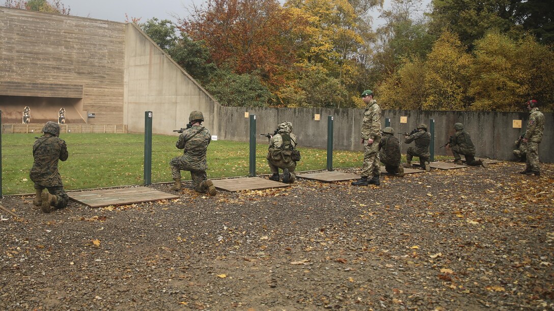U.S. Marines with 2nd Intelligence Battalion and British soldiers shoot during a combat marksmanship range near Edinburgh, U.K., Oct. 30, 2015. The service members are currently executing Exercise Phoenix Odyssey II, which is designed to build joint intelligence operational abilities while also enhancing military skills. 