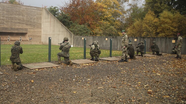 U.S. Marines with 2nd Intelligence Battalion and British soldiers shoot during a combat marksmanship range near Edinburgh, U.K., Oct. 30, 2015. The service members are currently executing Exercise Phoenix Odyssey II, which is designed to build joint intelligence operational abilities while also enhancing military skills. 