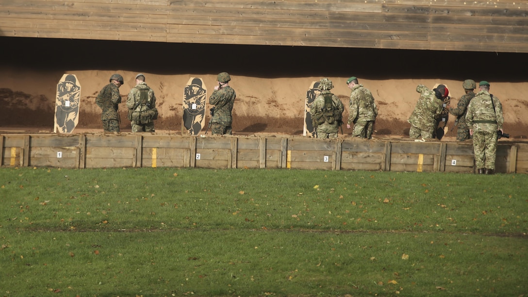 U.S. Marines with 2nd Intelligence Battalion and British soldiers shoot during a combat marksmanship range near Edinburgh, U.K., Oct. 30, 2015. The service members are currently executing Exercise Phoenix Odyssey II, which is designed to build joint intelligence operational abilities while also enhancing military skills. 