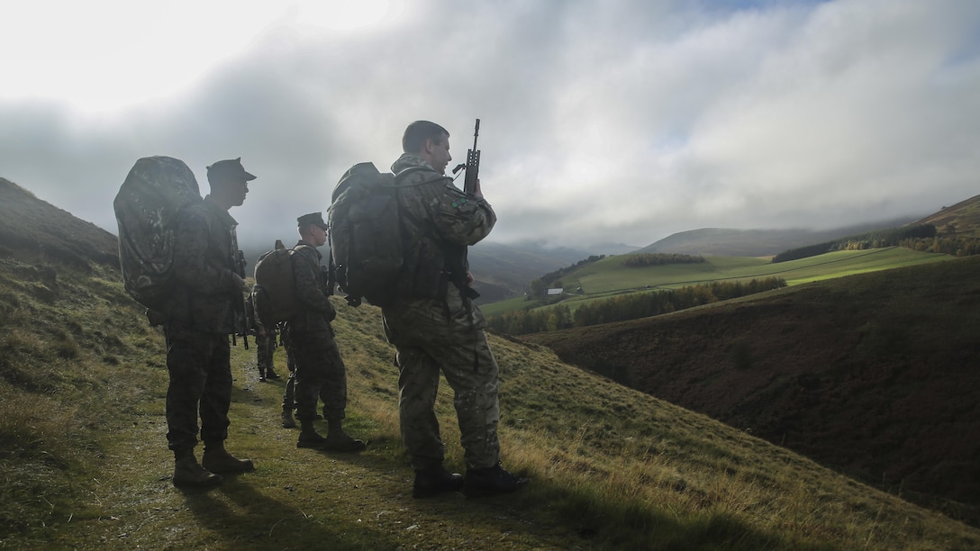 U.S. Marines with 2nd Intelligence Battalion and British soldiers search for a checkpoint during Exercise Phoenix Odyssey II near Edinburgh, U.K., Oct. 30, 2015. The service members executed a three-mile conditioning hike and shooting competition as part of the exercise, which is designed to enhance joint intelligence operations. 