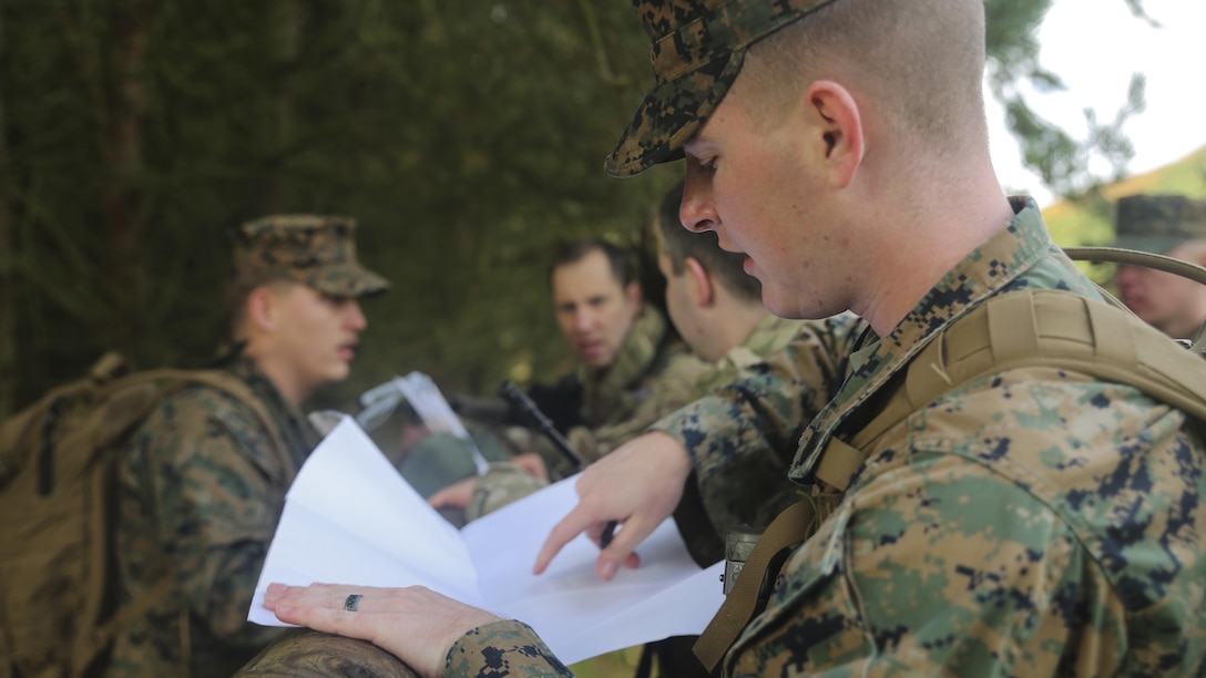 U.S. Marine Sgt. Kyle Bailey, an intelligence specialist with 2nd Intelligence Battalion, checks coordinates while searching for a checkpoint during Exercise Phoenix Odyssey II near Edinburgh, U.K., Oct. 30, 2015. The Marines are partnering with British soldiers to enhance joint intelligence operations, and worked to build military skills such as land navigation and combat marksmanship. 