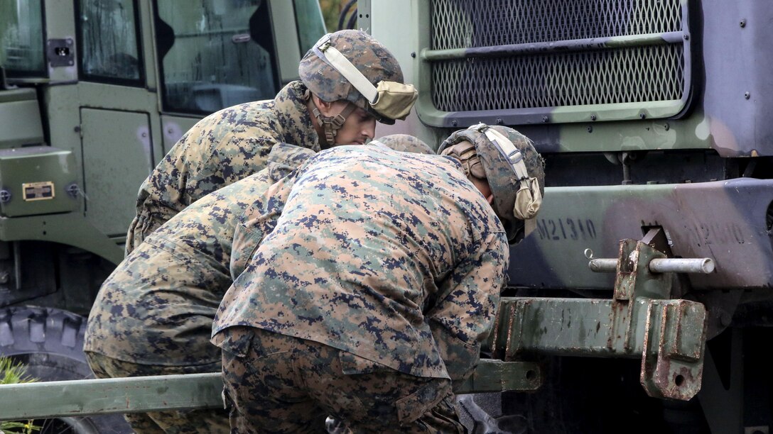 Marine students in the 8th Engineer Support Battalion Bridge Master’s Course rig a bridge piece to a seven-ton vehicle during a field exercise at Marine Corps Base Camp Lejeune, N.C., Nov. 4, 2015. The course teaches Marines to lead the bridge building process, and is hosting Marines from 9th Engineer Support Battalion, 3rd Marine Logistics Group, based in Camp Hansen, Okinawa. Marines used the seven-ton vehicle to push or pull the entire bridge as needed.