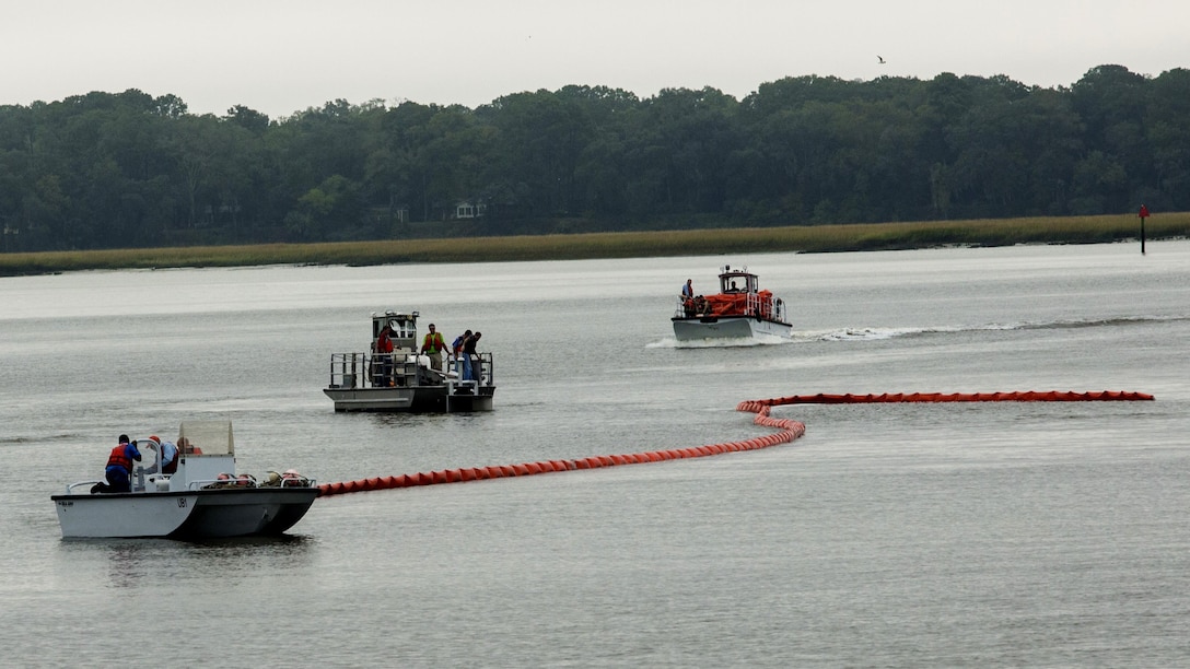 Marines and civilians clean up a simulated oil spill at Marine Corps Air Station Beaufort, S.C.,  Nov. 4, 2015. The exercise required multiple boats and two different teams; the facility response team and the spill management team. The Marines and civilians are with the Marine Corps Air Station Beaufort fuels sections and the Natural Resources Environmental Affairs Office.