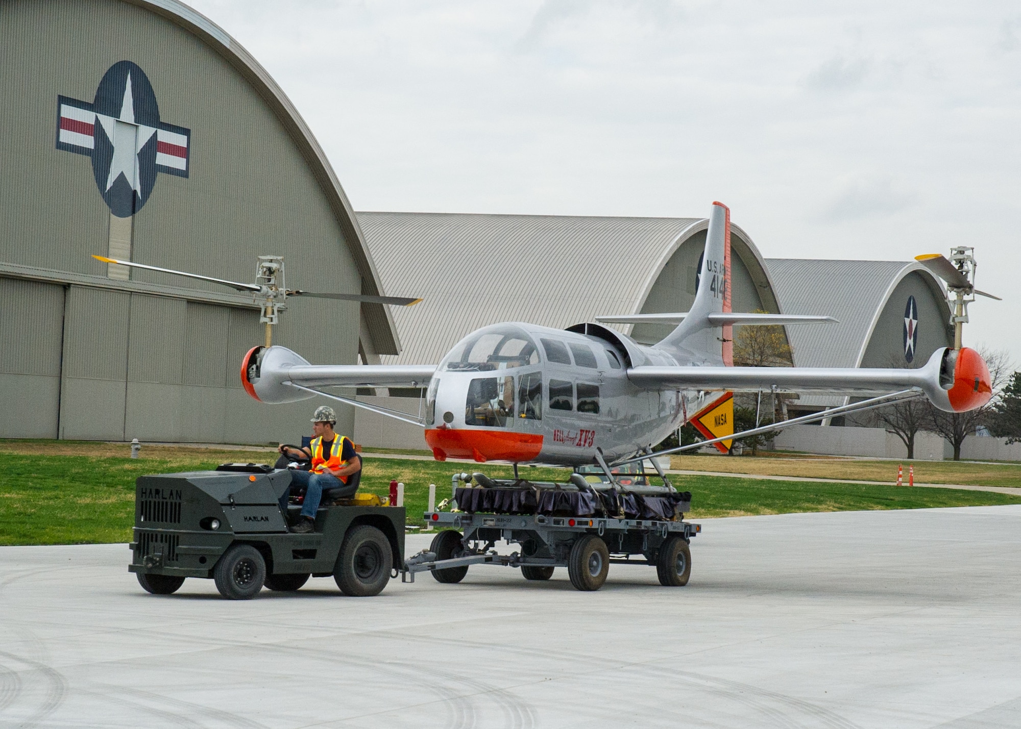 Restoration staff move the Bell Helicopter Textron XV-3 into the new fourth building at the National Museum of the U.S. Air Force on Nov. 5, 2015. (U.S. Air Force photo by Ken LaRock)