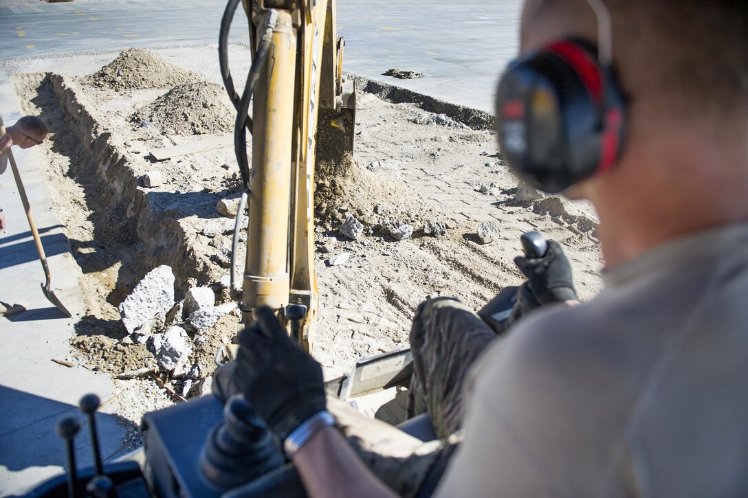 U.S. Air Force Tech. Sgt. David Blankenship operates a backhoe during a construction project at Bagram Airfield, Afghanistan, Nov. 4, 2015. Blankenship is a pavements and equipment technician assigned to the 455th Expeditionary Civil Engineer Squadron. U.S. Air Force photo by Tech. Sgt. Robert Cloys
