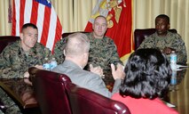 Maj. Gen. Charles L. Hudson, (center) commander, Marine Corps Installations Command, receives a brief from Bob James, director, Operations and Training Division, Marine Corps Logistics Base Albany, during Hudson’s visit, here, Nov. 4. Col. James C. Carroll III, (right) commanding officer, MCLB Albany, and Sgt. Maj. Anthony Cruz Jr., (left) sergeant major, MCICOM, attended the meeting.
