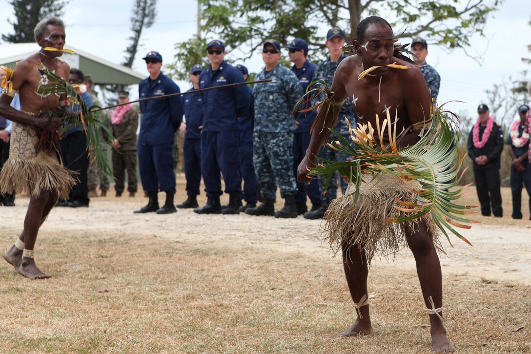 Cultural dancers welcome participants during the opening ceremony of Exercise KM 15-3 in Luganville, Vanuatu, Nov. 4, 2015. Military Sealift Command's dry cargo and ammunition ship the USNS Lewis and Clark anchored off the coast of Vanuatu and offloaded Marines and equipment for the exercise. U.S. Navy photo by Grady T. Fontana