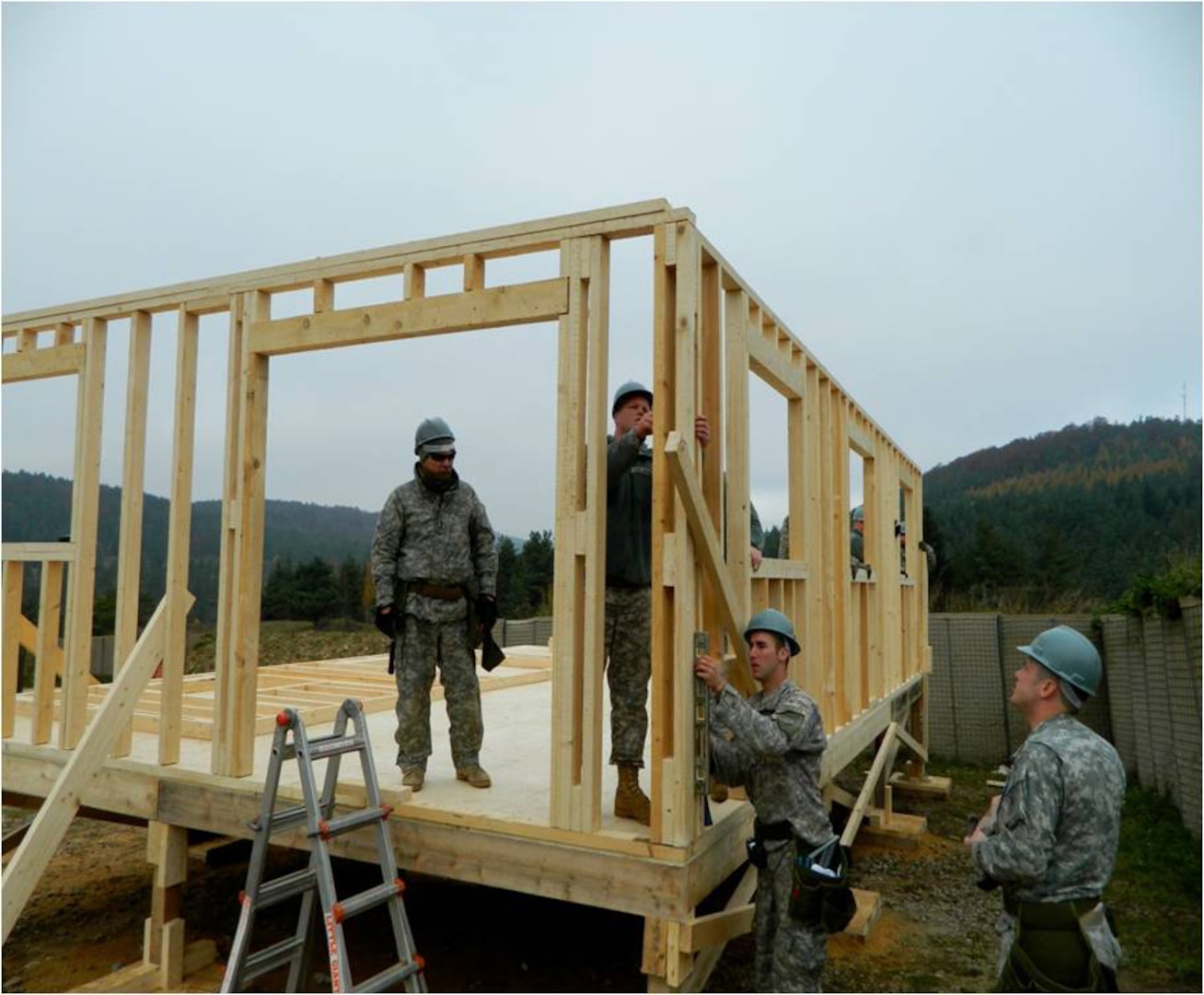 Kentucky Guard members of the 1123rd Sapper Company assemble a B-Hut, or temporary barracks, during an overseas deployment training mission at Joint Multinational Readiness Center in Hohenfels, Germany, Nov 2, 2011.