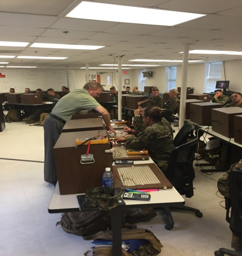 Mr. Downs, an instructor at Marine Corps Engineer School; teaches Marines attached to Basic Engineer Equipment Electrical Systems Technician course 1-16 (BEEEST 1-16) how to create circuits, test circuits, and how to apply the fundamentals of Ohms Law via practical application at Camp Lejeune, North Carolina.


