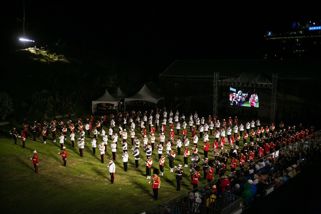 2nd Marine Aircraft Wing Band performs alongside other units during a mass performance at the Bermuda 50th Regiment Tattoo, 22-24 October. The Bermuda Tattoo presented a world-class spectacle of music and military precision at the historic grounds of the Keep Yard, Royal Naval Dockyard. Performers from the United States, United Kingdom, Canada and the Caribbean joined the Royal Bermuda Regiment Band and Corps of Drums. (Courtesy Photo)