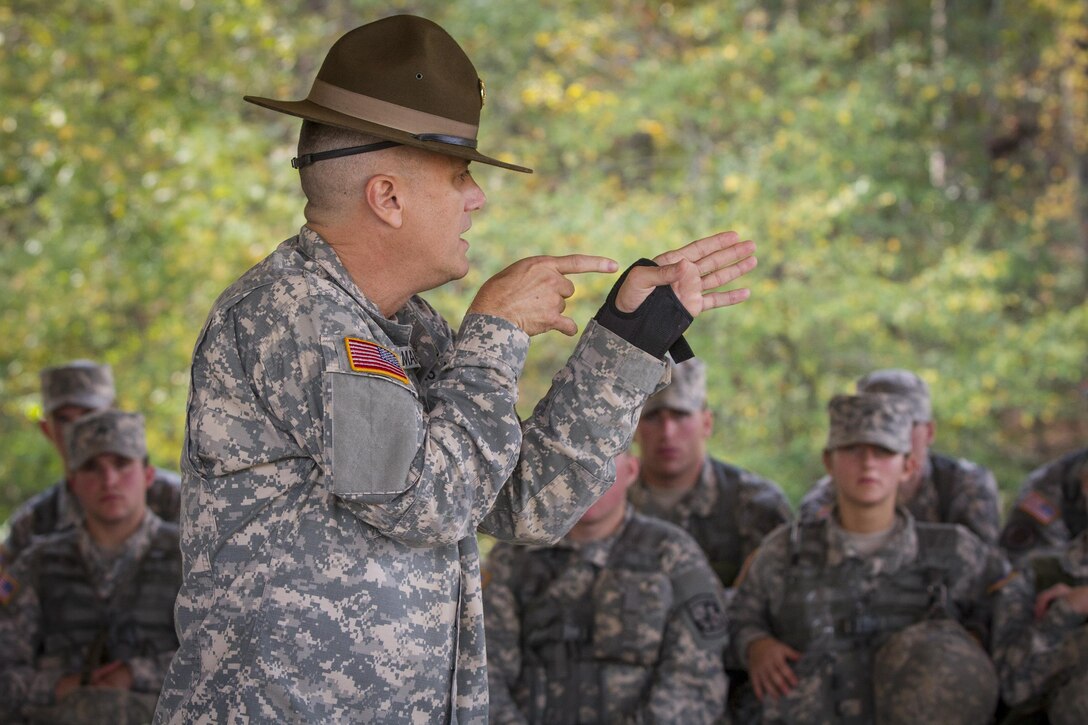 Army Staff Sgt. Hal Martin, foreground, teaches preliminary marksmanship to a group of Clemson University Reserve Officer Training Corps cadets during a leadership exercise in Clemson, S.C., Oct. 24, 2015. Martin is an Army Reserve drill sergeant assigned to the 98th Training Division's Company D, 1st Battalion, 518th Infantry Regiment, 2nd Brigade Combat Team. U.S. Army photo by Sgt. Ken Scar