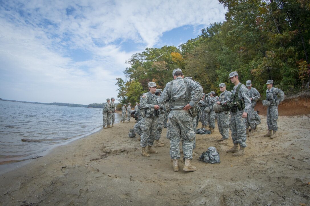 A group of Clemson University Reserve Officer Training Corps cadets assemble on the shore of Lake Hartwell after rappelling over a cliff as part of a leadership exercise in Clemson, S.C., Oct. 24, 2015. U.S. Army photo by Sgt. Ken Scar