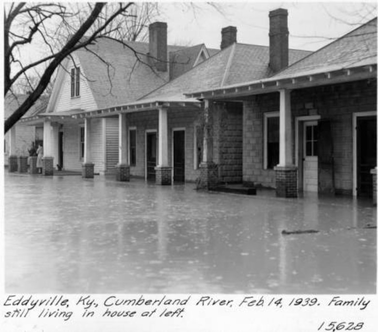 Homes are flooded by the Cumberland River in Eddyville, Ky., Feb. 14, 1939.  A family is still living in the house to the left. 
