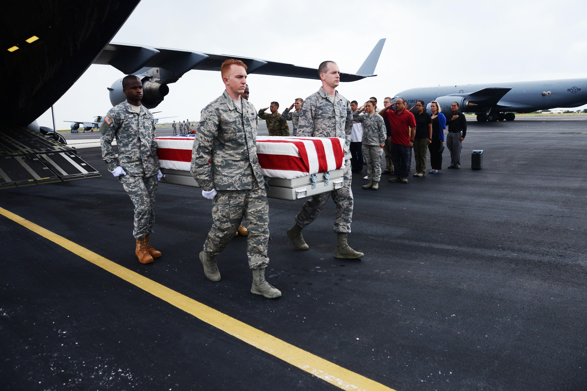 Honor guardsmen from the Defense POW/MIA Accounting Agency (DPAA) carry a transfer case containing unidentified remains recovered and flown from Malaysia at Joint Base Pearl Harbor-Hickam, Hawaii, Nov. 5, 2015.  These remains will be received by DPAA’s forensic laboratory for identification. The DPAA mission is to provide the fullest possible accounting for our missing personnel from past conflicts to their families and the nation. (DOD photo by Spc Crystal Madriz/Released)