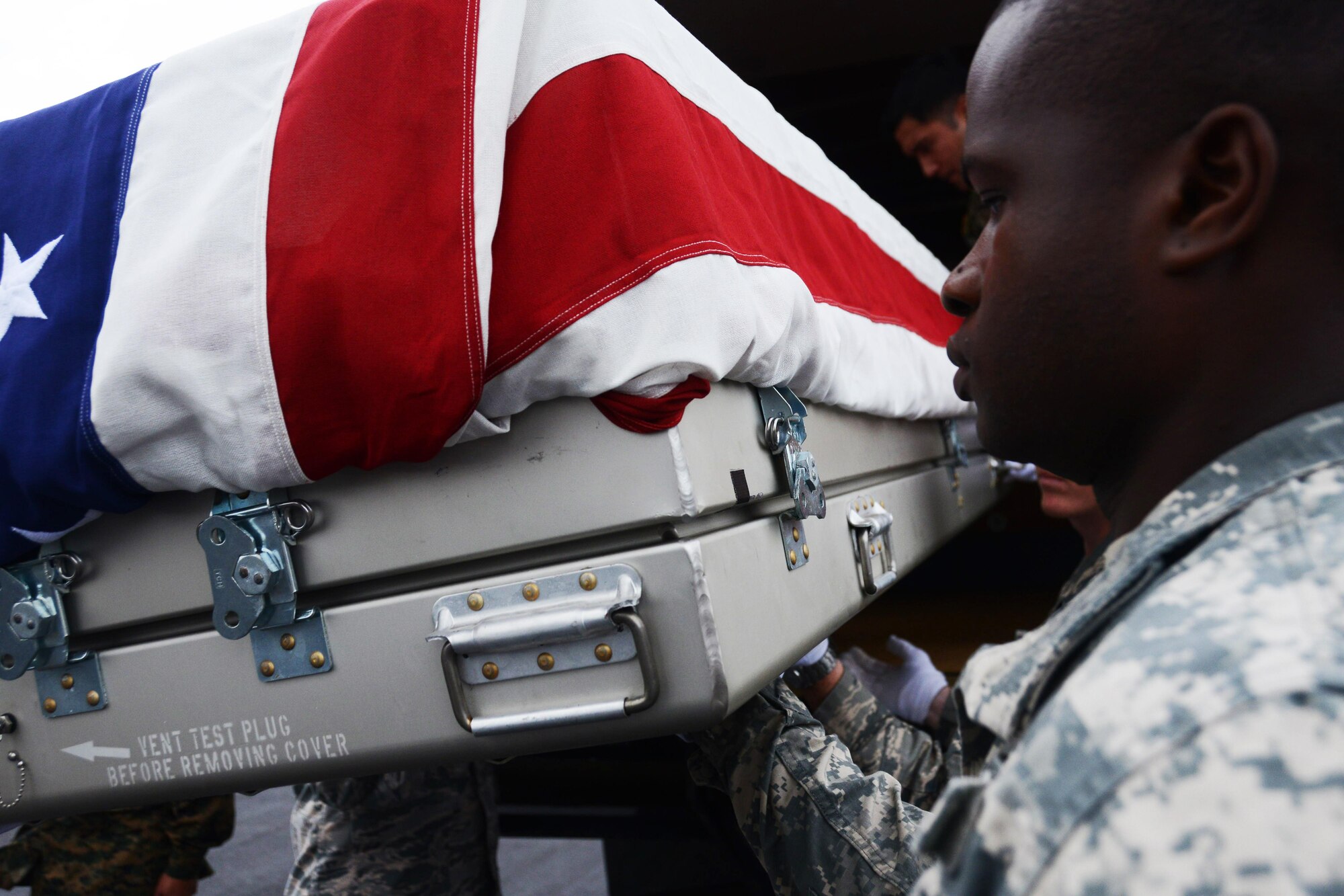 Honor guardsmen from the Defense POW/MIA Accounting Agency (DPAA) load a transfer case containing unidentified remains recovered and flown from Malaysia onto a transport truck at Joint Base Pearl Harbor-Hickam, Hawaii, Nov. 5, 2015.  These remains will be received by DPAA’s forensic laboratory for identification. The DPAA mission is to provide the fullest possible accounting for our missing personnel from past conflicts to their families and the nation. (DOD photo by Spc Crystal Madriz/Released)