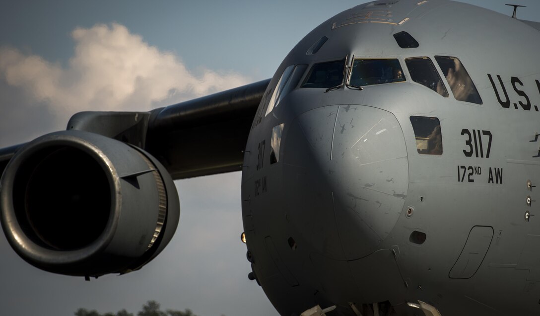 A Mississippi Air National Guard pilot from the 172nd Airlift Wing looks out the window during an engine run offload on the flightline at Camp Shelby Joint Forces Training Center, Miss., during Exercise Turbo Distribution Oct. 29, 2015. The U.S. Transportation Command exercise tests the joint task force-port opening's ability to deliver and distribute cargo during humanitarian relief operations. (U.S. Air Force photo/Staff Sgt.
Marianique Santos)
