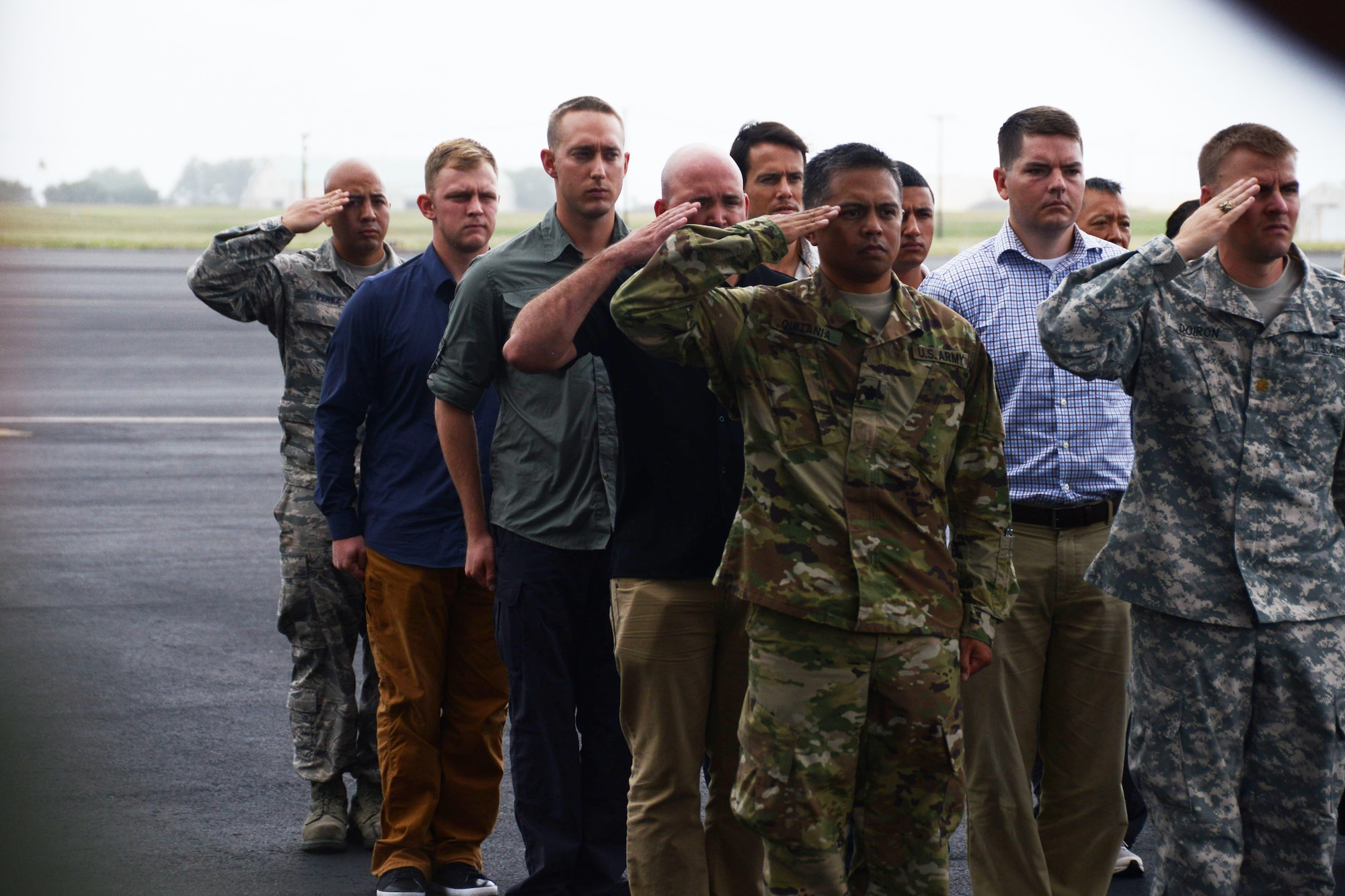 Personnel from the Defense POW/MIA Accounting Agency (DPAA) render honors for a transfer case containing unidentified remains recovered from Malaysia, on the flightline at Joint Base Pearl Harbor-Hickam, Hawaii, Nov. 5, 2015. These remains will be received by DPAA’s forensic laboratory for identification. The DPAA mission is to provide the fullest possible accounting for our missing personnel from past conflicts to their families and the nation. (DOD photo by Spc Crystal Madriz/Released)