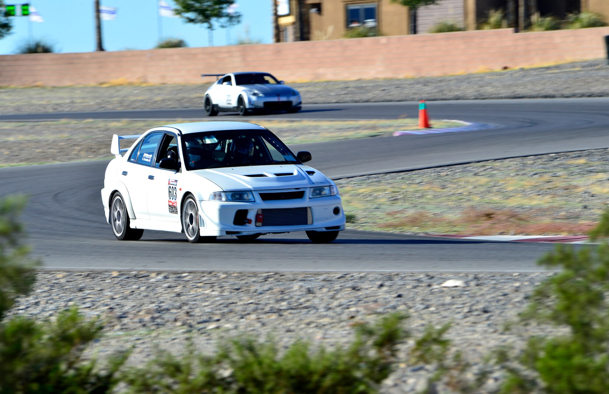 Tech. Sgt. Gabriel, a 432nd Wing/432nd Air Expeditionary Wing MQ-9 Reaper sensor operator, races his Mitsubishi Lancer Evolution at the Spring Mountain Raceway Nov. 1, 2015, in Pahrump, Nevada. Gabriel has owned and modified his Evolution for over five years. He's upgraded everything from the engine, suspension, brakes, and safety equipment to compete in time attack style racing. (U.S. Air Force photo/Airman 1st Class Christian Clausen) 