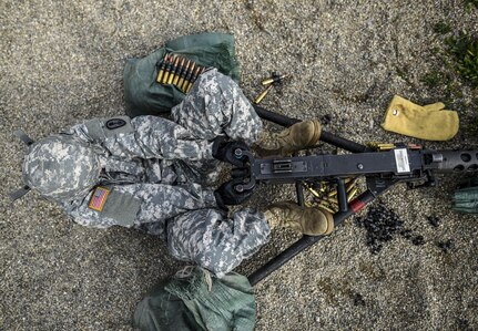 Cpl. Brittany Montana, a U.S. Army Reserve Soldier with the 354th Military Police Company, of St. Louis, fires an M2 Browning .50-caliber machine gun during a familiarization range at Camp Atterbury, Ind., Nov. 5. The 384th Military Police Battalion, headquartered at Fort Wayne, Ind., organized a three-day range and field training exercise involving more than 550 U.S. Army Reserve Soldiers and incorporated eight different weapons systems, plus combat patrolling and a rifle marksmanship competition at Camp Atterbury, Ind., Nov. 5-7. (U.S. Army photo by Master Sgt. Michel Sauret)