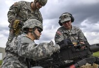 Cpl. Brittany Montana, a U.S. Army Reserve Soldier with the 354th Military Police Company, of St. Louis, loads a new clip of rounds into an M2 Browning .50-caliber machine gun during a familiarization range at Camp Atterbury, Ind., Nov. 5. The 384th Military Police Battalion, headquartered at Fort Wayne, Ind., organized a three-day range and field training exercise involving more than 550 U.S. Army Reserve Soldiers and incorporated eight different weapons systems, plus combat patrolling and a rifle marksmanship competition at Camp Atterbury, Ind., Nov. 5-7. (U.S. Army photo by Master Sgt. Michel Sauret)