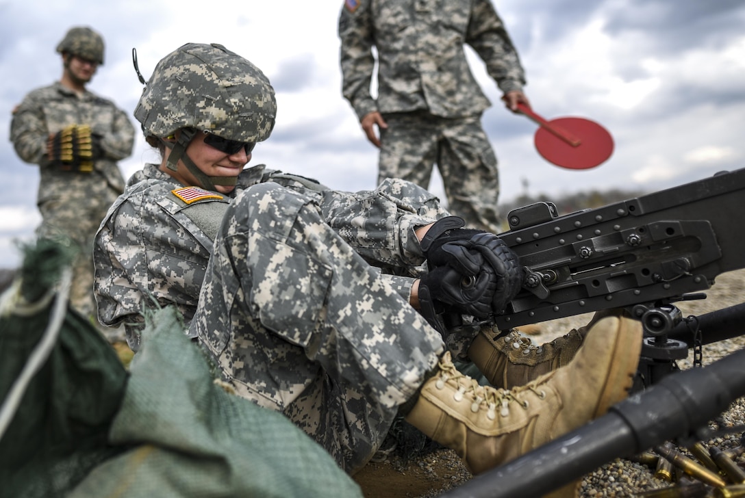 Cpl. Brittany Montana, a U.S. Army Reserve Soldier with the 354th Military Police Company, of St. Louis, pulls the charging handle of an M2 Browning .50-caliber machine gun during a familiarization range at Camp Atterbury, Ind., Nov. 5. The 384th Military Police Battalion, headquartered at Fort Wayne, Ind., organized a three-day range and field training exercise involving more than 550 U.S. Army Reserve Soldiers and incorporated eight different weapons systems, plus combat patrolling and a rifle marksmanship competition at Camp Atterbury, Ind., Nov. 5-7. (U.S. Army photo by Master Sgt. Michel Sauret)