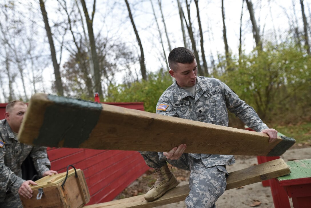 U.S. Army Reserve military police Soldiers navigate through a Leadership Reaction Course as part of a team-building exercise at Camp Atterbury, Ind., Nov. 5, during a three-day range training event hosted and organized by the 384th Military Police Battalion, headquartered at Fort Wayne, Ind. The field training involving more than 550 U.S. Army Reserve Soldiers and included ranges using eight different weapons systems, plus combat patrolling and a rifle marskmanship competition. (U.S. Army photo by Master Sgt. Michel Sauret)