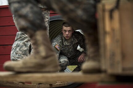 U.S. Army Reserve military police Soldiers navigate through a Leadership Reaction Course as part of a team-building exercise at Camp Atterbury, Ind., Nov. 5, during a three-day range training event hosted and organized by the 384th Military Police Battalion, headquartered at Fort Wayne, Ind. The field training involving more than 550 U.S. Army Reserve Soldiers and included ranges using eight different weapons systems, plus combat patrolling and a rifle marskmanship competition. (U.S. Army photo by Master Sgt. Michel Sauret)