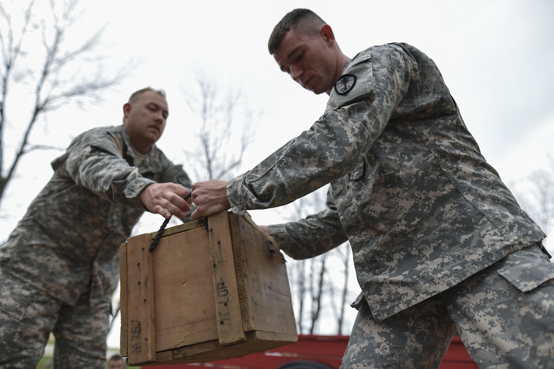 U.S. Army Reserve military police Soldiers pass along a box as they navigate through a Leadership Reaction Course as part of a team-building exercise at Camp Atterbury, Ind., Nov. 5, during a three-day range training event hosted and organized by the 384th Military Police Battalion, headquartered at Fort Wayne, Ind. The field training involving more than 550 U.S. Army Reserve Soldiers and included ranges using eight different weapons systems, plus combat patrolling and a rifle marskmanship competition. (U.S. Army photo by Master Sgt. Michel Sauret)