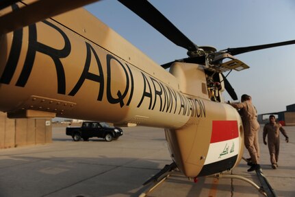 Iraqi Army Aviation Command, Squadron 21 members prepare a Bell 407 helicopter for takeoff at Taji Air Base, July 14, 2011.