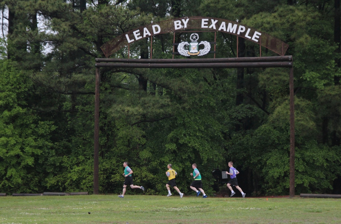 Competitors run on the Fort Bragg Noncommissioned Officers Academy track during the two-mile run portion of thier Army Physical Fitness Test, April 29. U.S. Army Civil Affairs & Psychological Operations Command (Airborne) competitors came from around the country to compete in this year's Best Warrior Competition held at Fort Bragg, N.C., April 29 through May 3, to earn the honor of representing the command at the U.S. Army Reserve Command's competition in June. (U.S. Army photo by Staff Sgt. Sharilyn Wells/USACAPOC(A))