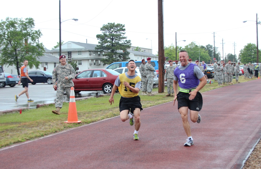 Competitors sprint to the finish line of their two-mile run during the Best Warrior Competition, April 29. U.S. Army Civil Affairs & Psychological Operations Command (Airborne) competitors came from around the country to compete in this year's Best Warrior Competition held at Fort Bragg, N.C., April 29 through May 3, to earn the honor of representing the command at the U.S. Army Reserve Command's competition in June. (U.S. Army photo by Staff Sgt. Sharilyn Wells/USACAPOC(A))