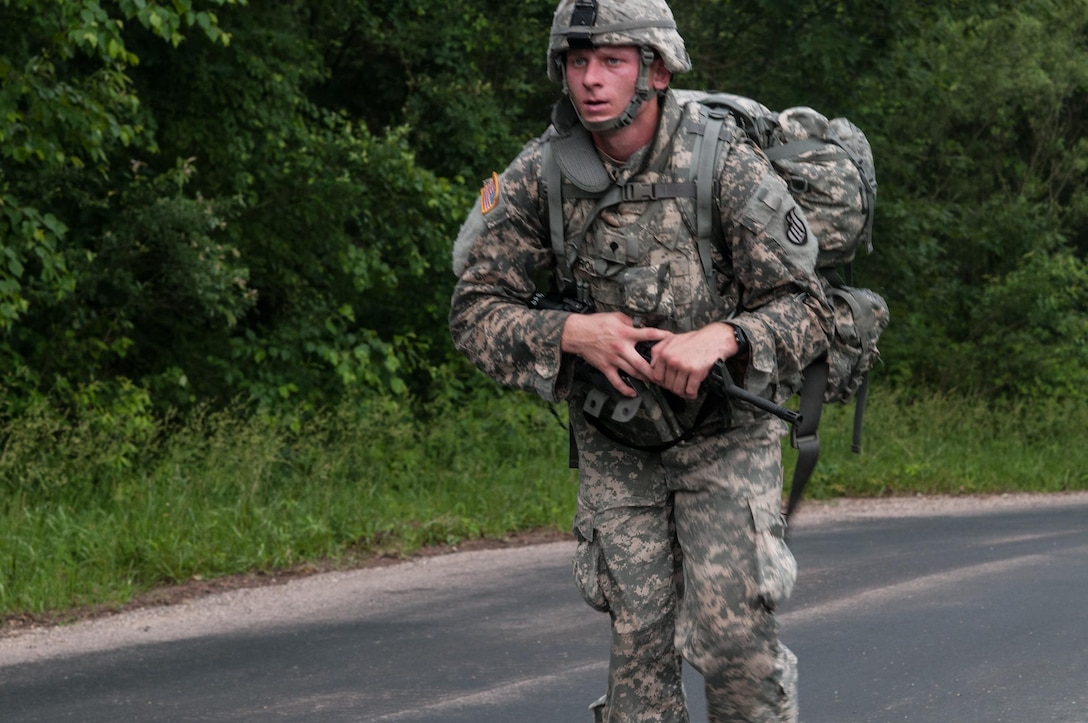 Army Reserve Spc. Mitchell Fromm, a combat engineer representing the  416th Theater Engineer Command and a native of Marathon City, Wis., competes in the 10km ruck march event at the 2013 U.S. Army Reserve Best Warrior Competition at Fort McCoy, Wis., June 26. The Warriors had two and half hours to complete the course. This year's Best Warrior competition will determine the top noncommissioned officer and junior enlisted Soldier who will represent the Army Reserve in the Dept. of the Army Best Warrior competition in Oct. at Fort Lee, Va.