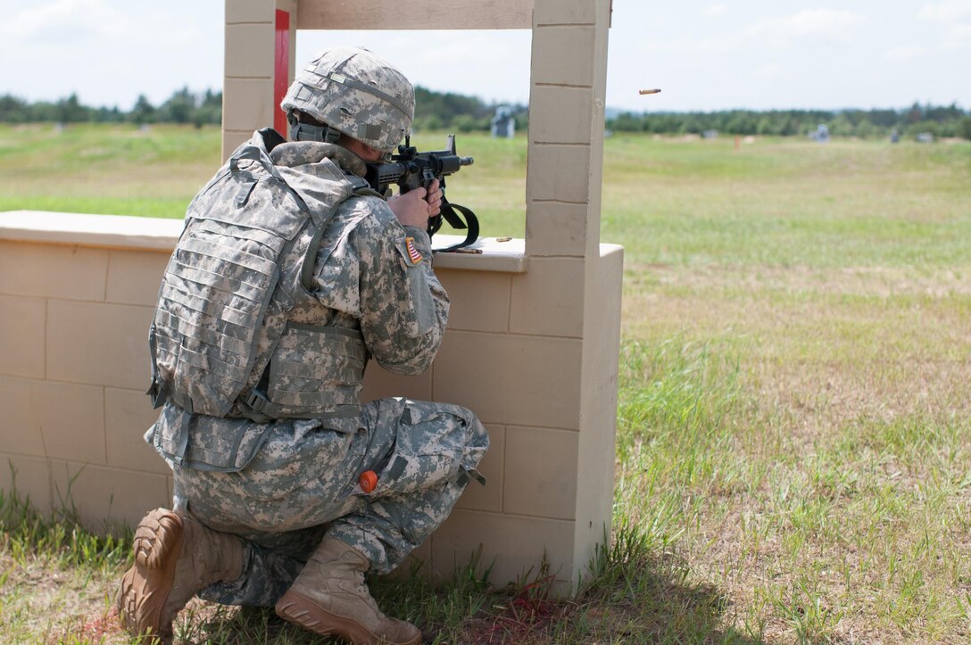 Army Reserve Spc. Mitchell Fromm, a combat engineer representing the 416th Theater Engineer Command and a native of Marathon, Wis., engages targets during the Reflexive Fire event at the 2013 U.S. Army Reserve Best Warrior Competition at Fort McCoy, Wis., June 26. This year's Best Warrior competition will determine the top noncommissioned officer and junior enlisted Soldier who will represent the Army Reserve in the Dept. of the Army Best Warrior competition in Oct. at Fort Lee, Va.