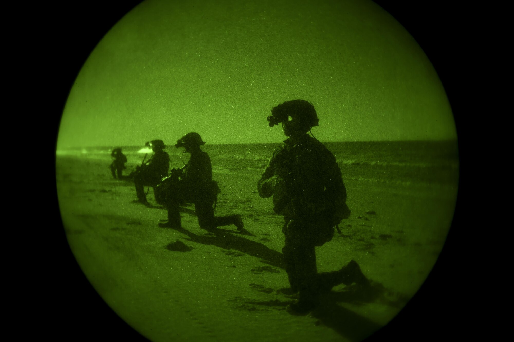 Marine Raiders with the Marine Corp Special Operations Command perform infiltration training at the Eglin Range, Fla., Oct. 30, 2015. The Raiders were dropped 12 miles off the shore and navigated through the darkness to infiltrate a pre-designated compound. (U.S. Air Force photo by Senior Airman Christopher Callaway) 