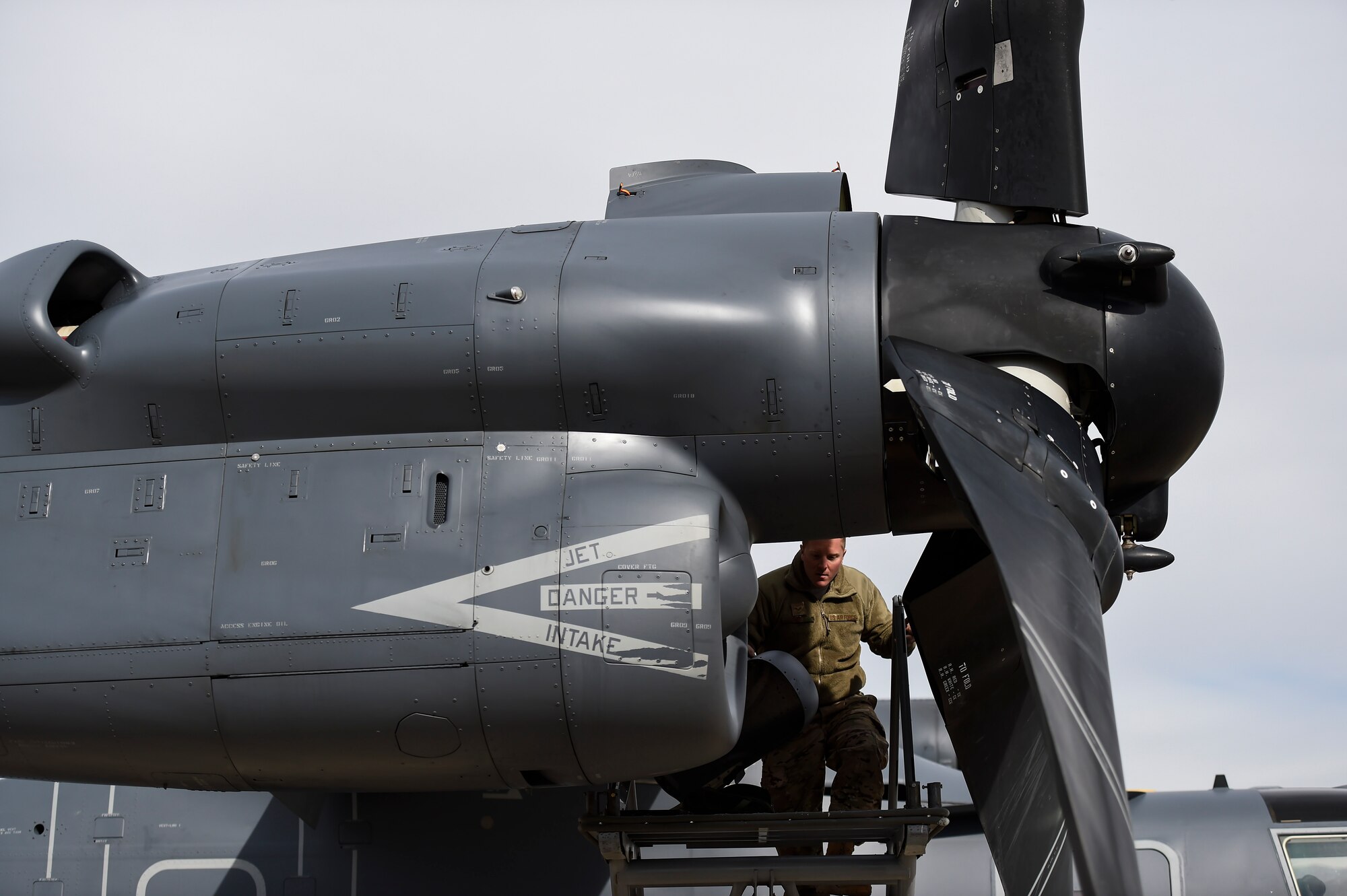 Senior Airman Daniel Gurka, crew chief with the 901st Aircraft Maintenance Squadron, finishes repairs on a CV-22B Osprey engine at Hill Air Force Base, Utah, Nov. 2, 2015. The exercise enabled Airmen to perform their duties in a simulated expeditionary environment outside of their home stations. (U.S. Air Force by Airman Kai White)