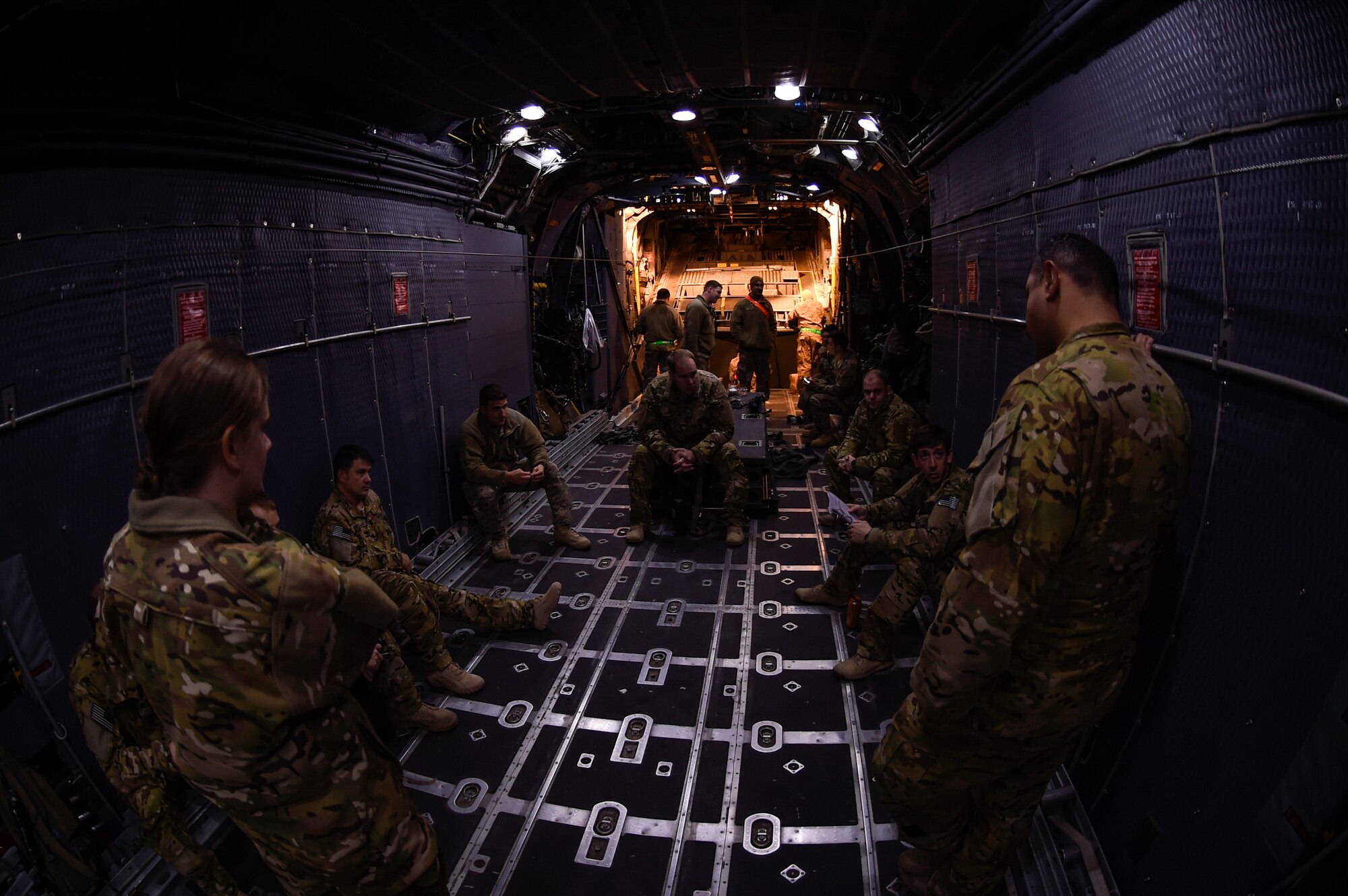 Airmen with the 15th Special Operations Squadron conduct a pre-mission briefing before a low-level night flight at Hill Air Force Base, Utah, Nov. 2, 2015. The exercise allowed Airmen to perform their duties in a simulated expeditionary environment outside of their home stations. (U.S. Air Force by Airman Kai White)