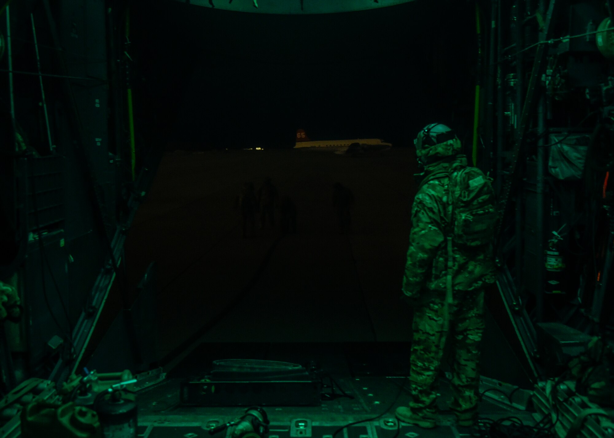Tech. Sgt. Joseph Montgomery, a loadmaster with the 15th Special Operations Squadron, oversees Airmen breaking down a forward area refueling point at the Utah Test and Training Range, Utah, Nov. 3, 2015. Airmen with the 1st Special Operations Wing practiced various skills required for overseas contingency operations during the exercise. (U.S. Air Force photo by Airman Kai White)
