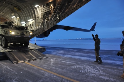 U.S. Army Alaska Strykers, assigned to Bravo Company, 3-21 Infantry Regiment, 1st Stryker Brigade Combat Team, offloads from an Air Force C-17 Globemaster above the Arctic Circle as part of Operation Arctic Pegasus at Deadhorse, Alaska, Nov. 3, 2015.  Arctic Pegasus is U.S. Army Alaska's annual joint exercise designed to test rapid-deployment and readiness in the Arctic. The exercise marks the first time Strykers have deployed above the Arctic Circle. The 1st Stryker Brigade Combat Team is the Army's northernmost unit and has the unique capability to deploy and operate in extreme cold regions. (Photo by Sgt. 1st Class Joel Gibson, U.S. Army Alaska Public Affairs)
