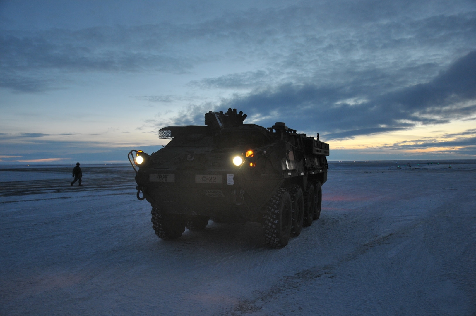 A U.S. Army Alaska Stryker from Bravo Company, 3-21 Infantry Regiment, 1st Stryker Brigade Combat Team, drives down the flight line after offloading from an Air Force C-17 Globemaster above the Arctic Circle as part of Operation Arctic Pegasus at Deadhorse, Alaska, Nov. 3, 2015. Arctic Pegasus is U.S. Army Alaska's annual joint exercise designed to test rapid-deployment and readiness in the Arctic. The exercise marks the first time Strykers have deployed above the Arctic Circle. The 1st Stryker Brigade Combat Team is the Army's northernmost unit and has the unique capability to deploy and operate in extreme cold regions. (Photo by Sgt. 1st Class Joel Gibson, U.S. Army Alaska Public Affairs)