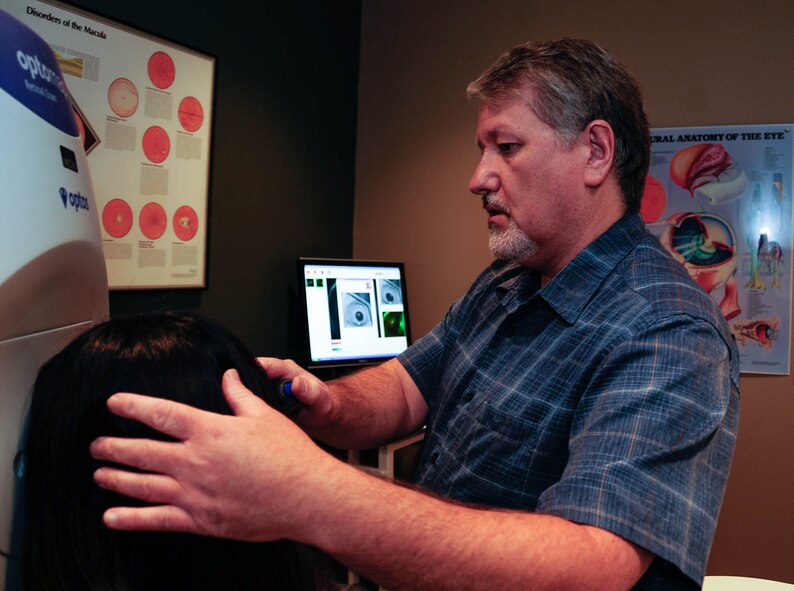 Michael Hoskins, 2nd Aerospace Medicine Squadron civilian, uses a retinal scanner to take a snapshot of a patient’s eye at Barksdale Air Force Base, La., Oct. 22, 2015. The screening tool is used for the early detection of disease or abnormalities in the back of an eye. These images can be used in preventative medicine and eye health and wellness. (U.S. Air Force photo/Staff Sgt. Jason McCasland) 