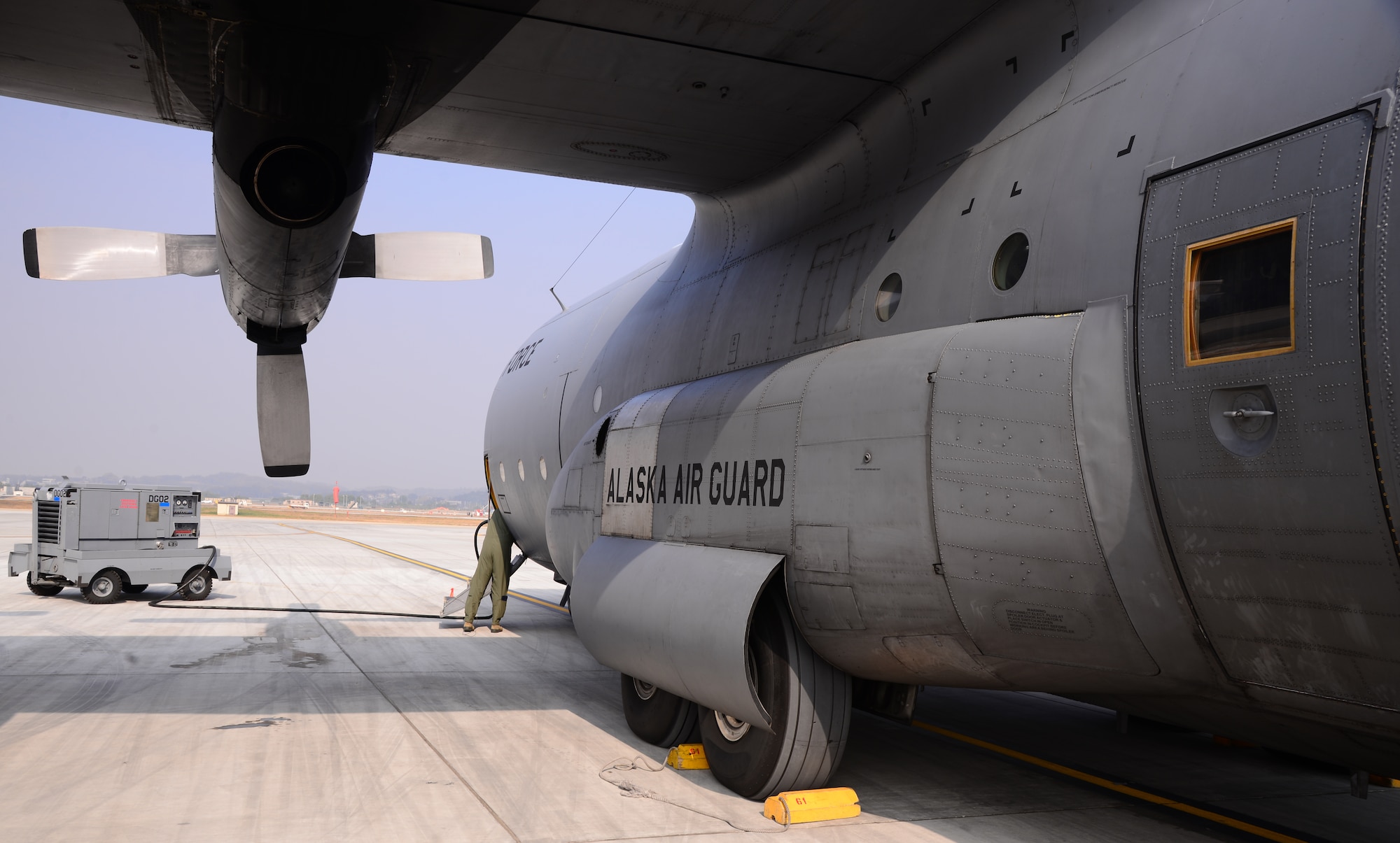 An Air National Guard HC-130 Combat King II cargo aircraft assigned to the 144th Airlift Squadron, Joint Base Elmendorf-Richardson, Alaska, waits while Vigilant Ace 16 aeromedical evacuation victims are loaded Nov. 5, 2015, at Osan Air Base, Republic of Korea. The 144th AS is participating in Vigilant Ace 16, a large-scale exercise designed to enhance combat capabilities and interoperability of the U.S. and Republic of Korea Air Forces. (U.S. Air Force photo/Staff Sgt. Benjamin Sutton)
