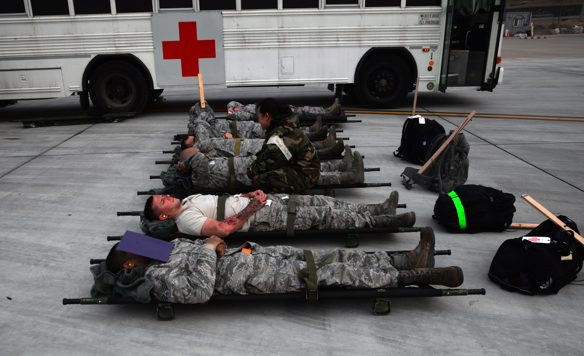 Simulated mass casualty victims participating in readiness exercise Vigilant Ace 16 wait to be loaded onto an HC-130 Combat King II cargo aircraft during an aeromedical evacuation Nov. 5, 2015, at Osan Air Base, Republic of Korea. More than eight squadrons are participating in Vigilant Ace 16, a large-scale exercise designed to enhance combat capabilities and interoperability of the U.S. and Republic of Korea Air Forces. (U.S. Air Force photo/Staff Sgt. Benjamin Sutton)