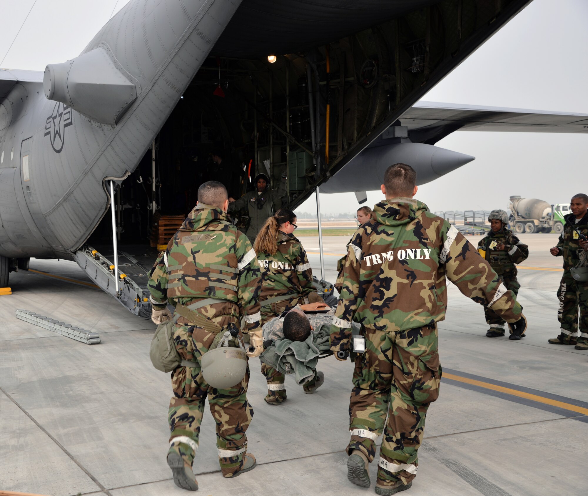 Members from the 51st Medical Group load a simulated casualty onto an HC-130 Combat King II cargo aircraft during an aeromedical evacuation Nov. 5, 2015, at Osan Air Base, Republic of Korea. The simulated evacuation was part of Vigilant Ace 16, a large-scale exercise designed to enhance combat capabilities and interoperability of the U.S. and Republic of Korea Air Forces. (U.S. Air Force photo/Staff Sgt. Benjamin Sutton)
