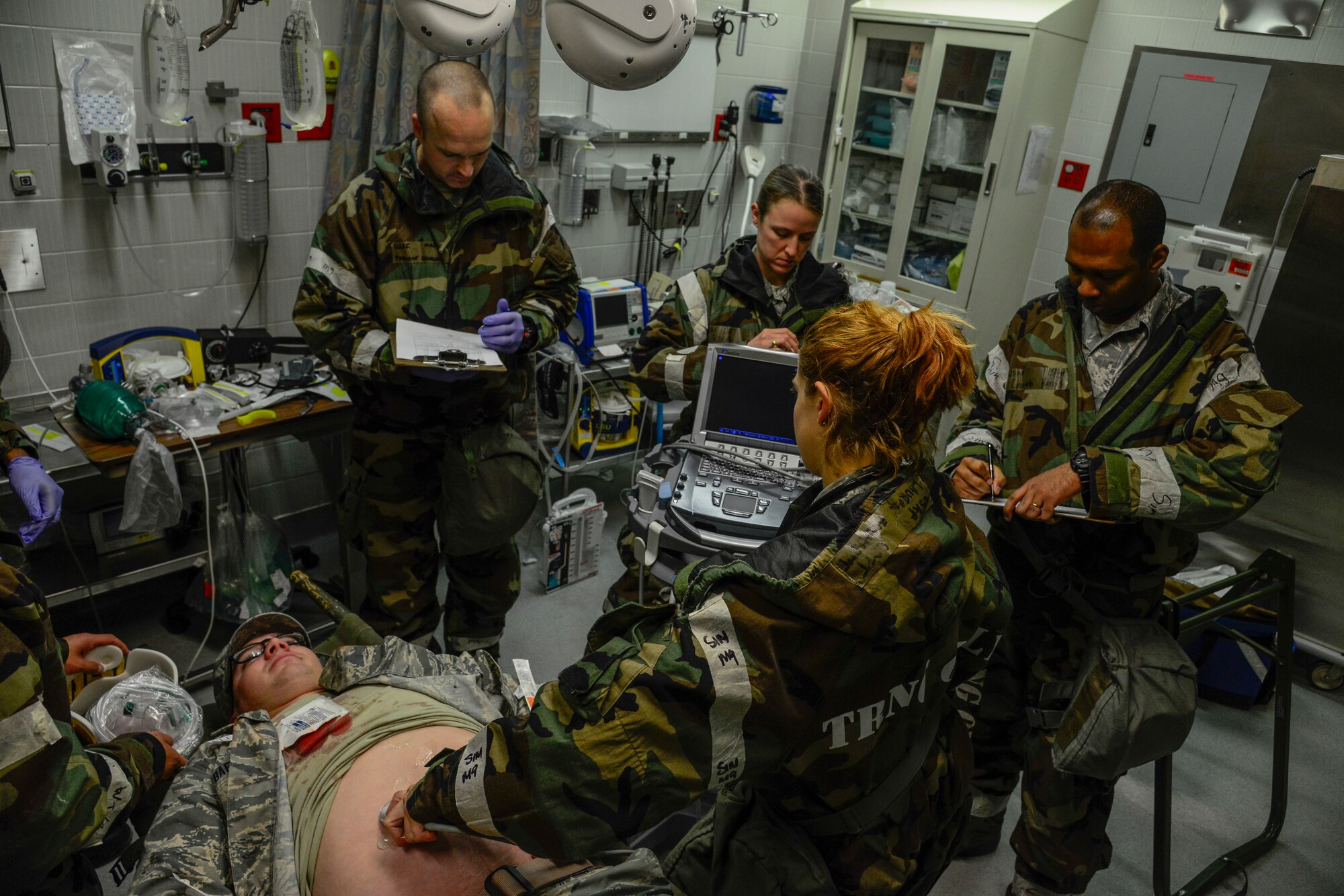 Airmen from the 51st Medical Operations Squadron work together to stabilize a patient during the Vigilant Ace 16 exercise on Osan Air Base, Republic of Korea, Nov. 3, 2015. The MDOS, along with members from the rest of Team Osan, are participating in the peninsula-wide exercise, which focuses on increasing interoperability between the joint U.S. forces and their ROK allies. The MDOS Airmen are utilizing Vigilant Ace 16 as an opportunity to gain knowledge and proficiency in the event of real-world contingencies. (U.S. Air Force photo/Senior Airman Kristin High)