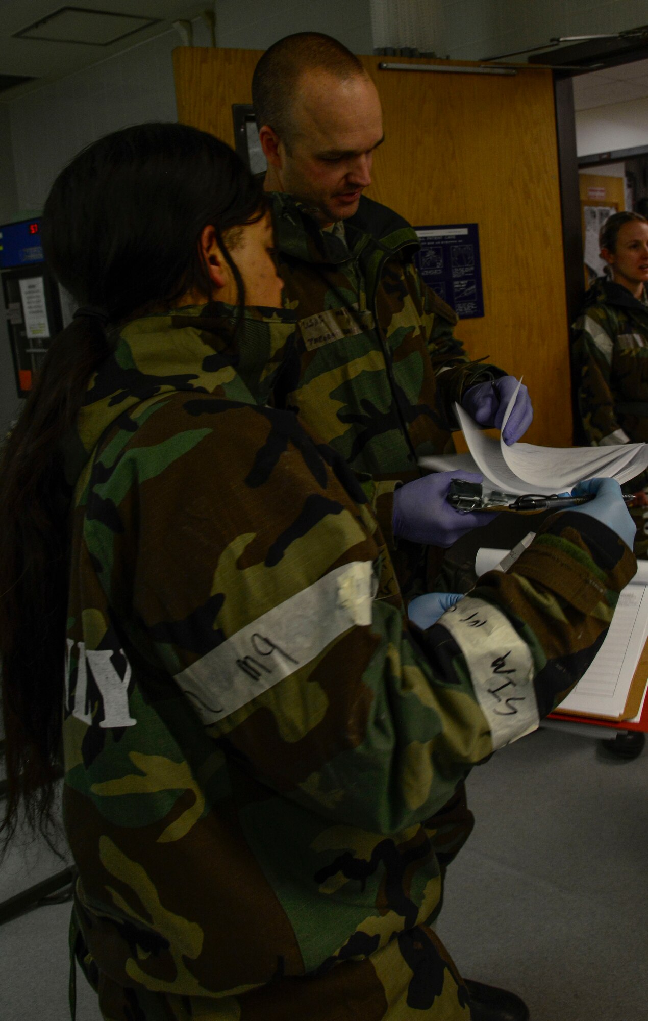 Staff Sgt. Emily Brown, 51st Medical Operations Squadon medical technician and Maj. T.J. Szerszenski, 51st MDOS emergency services element chief, discuss simulated patient charts during the Vigilant Ace 16 exercise on Osan Air Base, Republic of Korea, Nov. 3, 2015. The exercise is giving the MDOS the opportunity to enhance training, allowing Airmen to hone vital skills in the event of real-world contingencies. (U.S. Air Force photo/Senior Airman Kristin High)