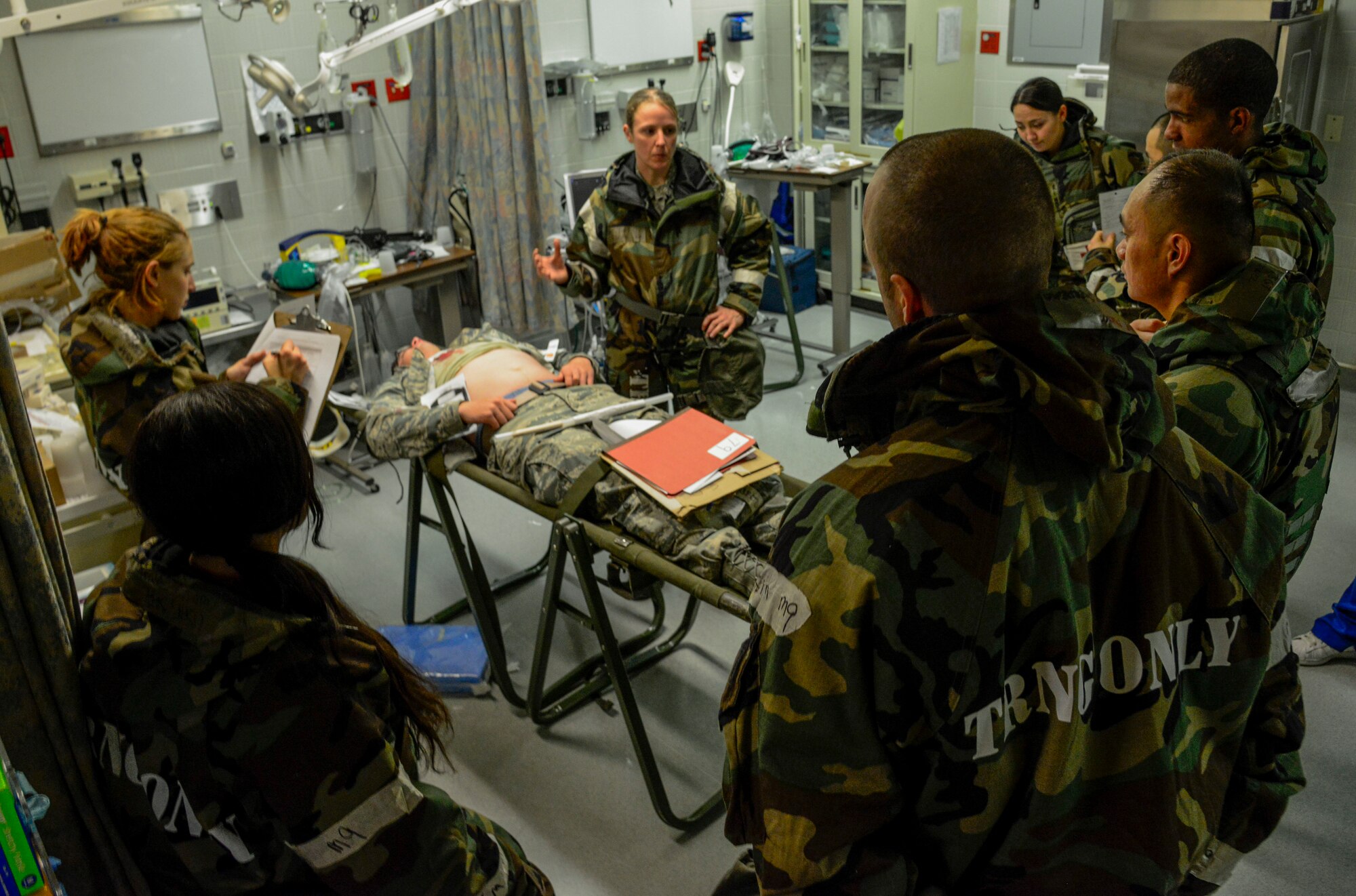Capt. Regan Lyon, 51st Medical Operations Squadron emergency medical physician, briefs her team while simulating patient care during the Vigilant Ace 16 exercise on Osan Air Base, Republic of Korea, Nov. 3, 2015. The exercise is an annual peninsula-wide operation used to enhance the U.S. and ROK alliance through operational and tactical level joint combat training. The MDOS Airmen are utilizing the exercise to perfect real-world skills through active role-playing with simulated patient care. (U.S. Air Force photo/Senior Airman Kristin High)