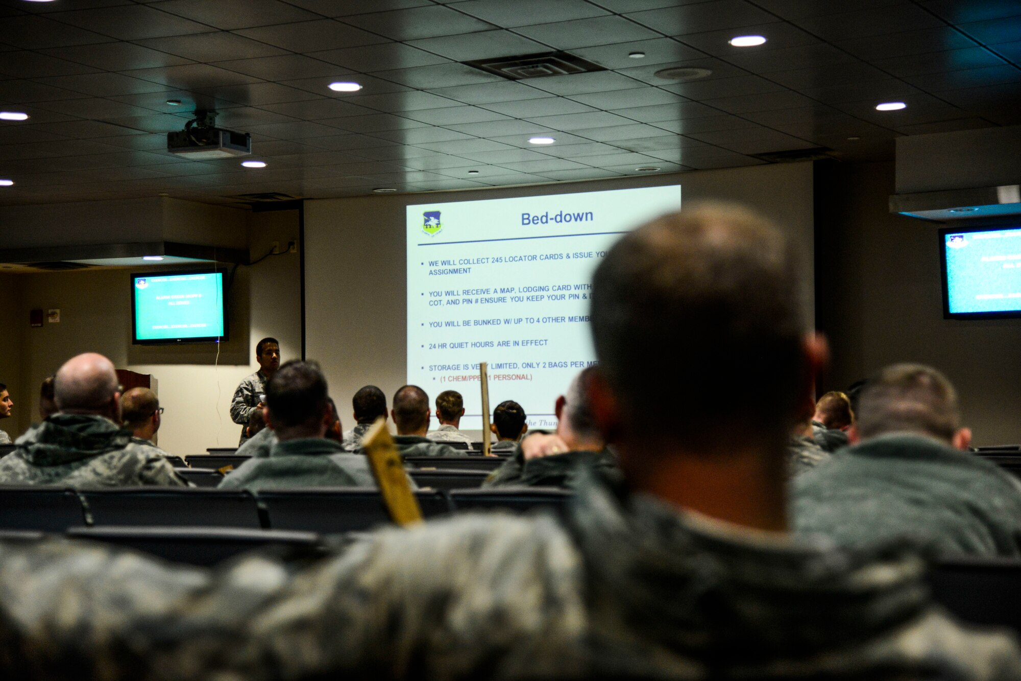 Augmentee Airmen from the 35th Fighter Wing, Misawa Air Base, Japan, listen to an inbound briefing during the Vigilant Ace 16 exercise on Osan Air Base, Republic of Korea, Nov. 2, 2015. The Airmen deployed to the peninsula to participate with more than 16,000 personnel in an effort to practice various combat training scenarios between the U.S. and ROK forces. (U.S. Air Force photo/Senior Airman Kristin High)